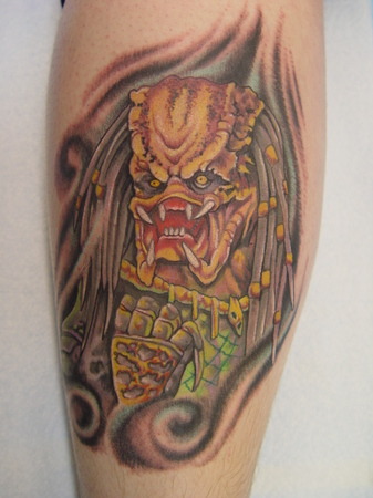 This Predator tattoo looks like it was drawn to depict the Predator being born, exiting the Predavagina, and saying “Ohai!” (via Maxim's 10 Awesome Predator 