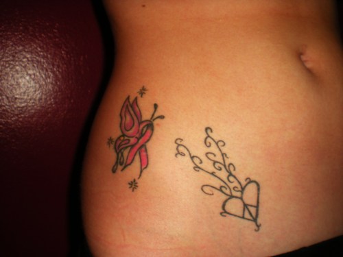 Tattoo #1: A heart peace sign. #2 A breast cancer butterfly for my gram