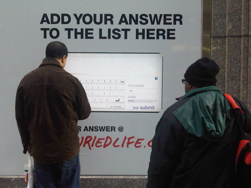 The question he is answering is, &#8220;What do you want to do before you die?&#8221; The answers are then streamed on a screen just outside this photo to the left. It&#8217;s an ad for The Buried Life on MTv.&nbsp; I passed this somewhere in the mid-forties on 5th avenue on my way to lunch.