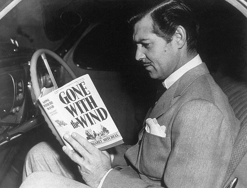wehadfacesthen:

Clark Gable, 1939, reading you-know-what. Publicity still for the movie.

And I&#8217;m going to see this tomorrow night and the night after on the big screen - yay! I&#8217;ve seen it many times before in theatres but it&#8217;s always a huge thrill!  &lt;3