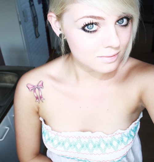 my new tattoo a pink bow :). my new tattoo. a pink bow :)