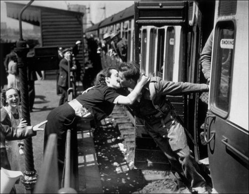 A soldier of the British Expeditionary Force, arriving back from Dunkirk, is greeted affectionately by his girlfriend, May 1940. Photographer unknown [via the BBC News Archive]