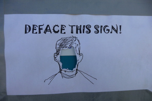 &#8220;This was at Burning Man 2009&#8212;a piece of paper stuck onto a portapotty. I had my knife with me, and did exactly what was instructed.&#8221;
(reader submitted photo - send your defacement pics here)