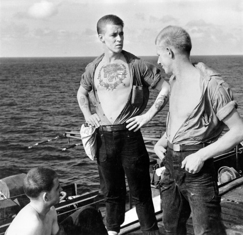Edward J Steichen Tattooed sailor is admired by two shipmates on flight 