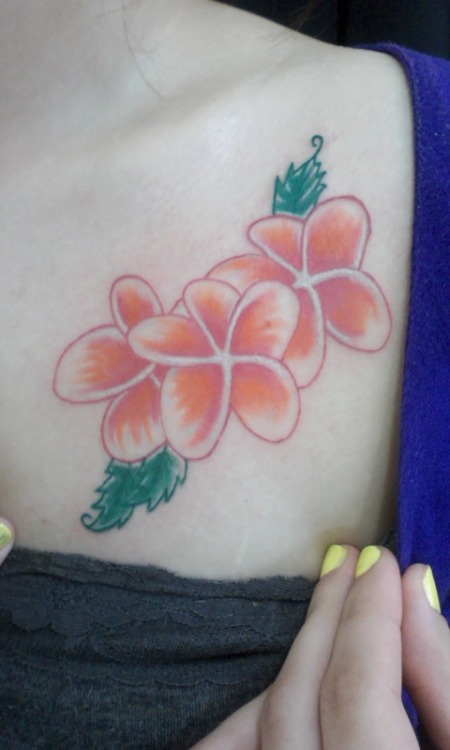 This is my tattoo. These are plumeria flowers which are my favorite.