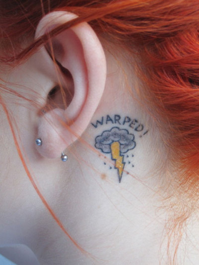 small tattoo designs behind ear. a small tattoo designs on