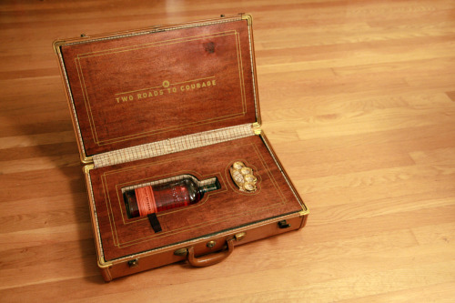 If I may blow your mind for a second&#8230; this is the birthday gift that I received from our friends Curtis and Karen last night. It&#8217;s a suitcase - perfectly fitted for a bottle of bourbon and a set of brass knuckles. The outside says, &#8220;Life is either a daring adventure, or nothing. Sack up.&#8221; The inside offers, &#8220;The two roads to courage.&#8221; They built/screenprinted the whole thing. It&#8217;s incredible. And my friends are amazing.Anyway, it will forever be on display in our house if you&#8217;d like to stop by and see it. I can&#8217;t promise you that the bourbon bottle will be full, but I can promise you it&#8217;s worth seeing in person.Here are a few more photos:


