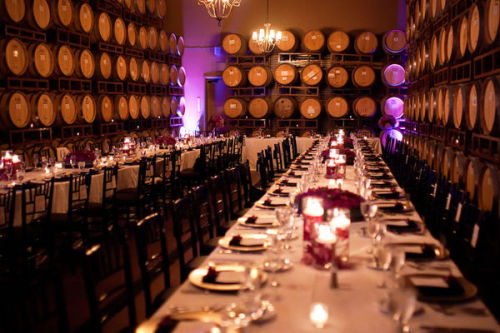 Love the intimate atmosphere of this wedding dinner held in the barrel room