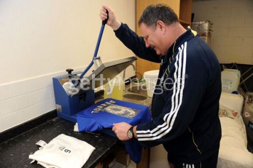Chelsea kit man, Mick Roberts printing Torres's first Chelsea shirt :)