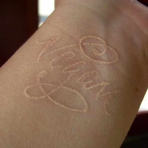 vegan white ink wrist tattoo