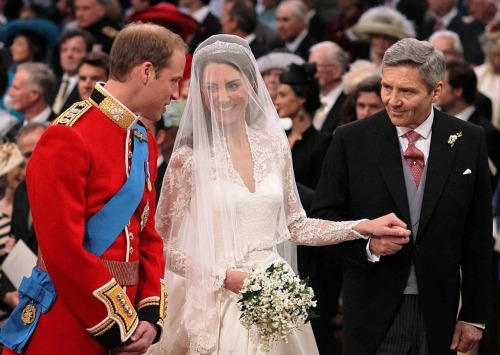 
Catherine Middleton, holding the hand of her father Michael, gives Prince William a big smile while joining him at the altar.
Slideshow: The Royal Wedding

It&#8217;s all fun and games till someone screws up the royal curtsey.
