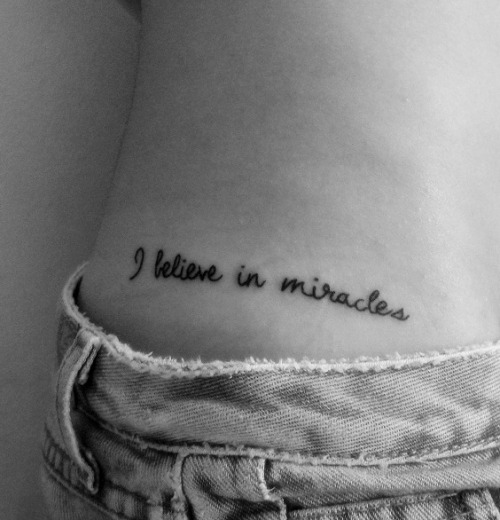 My tattoo on hip one letter of a song the Ramones I Believe in Miracles