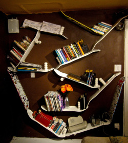 Bookshelf made from skateboard decks by Taylor Hamilton.