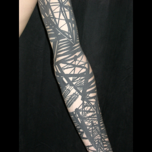 Blackwork power pylon abstract sleeve by Duncan X Into You Tattoo London