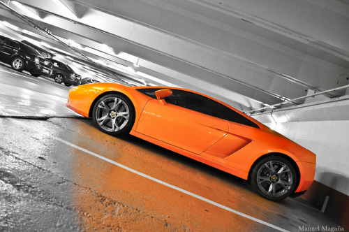 Orange Lamborghini Gallardo parked in an underground parking