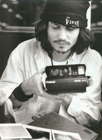 Johnny Depp with a Polaroid. 